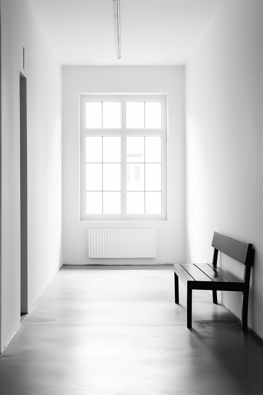 Black and white newspaper photo of an empty hallway